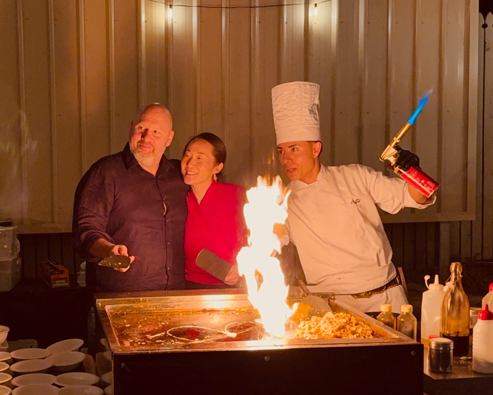 Josh and Mel watching Chef Miguel send a column of flame up from the teppanyaki grill